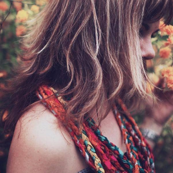 Woman wearing braided necklace from At the Bahamas: Multi Colored Sari Silk Ribbon Yarn