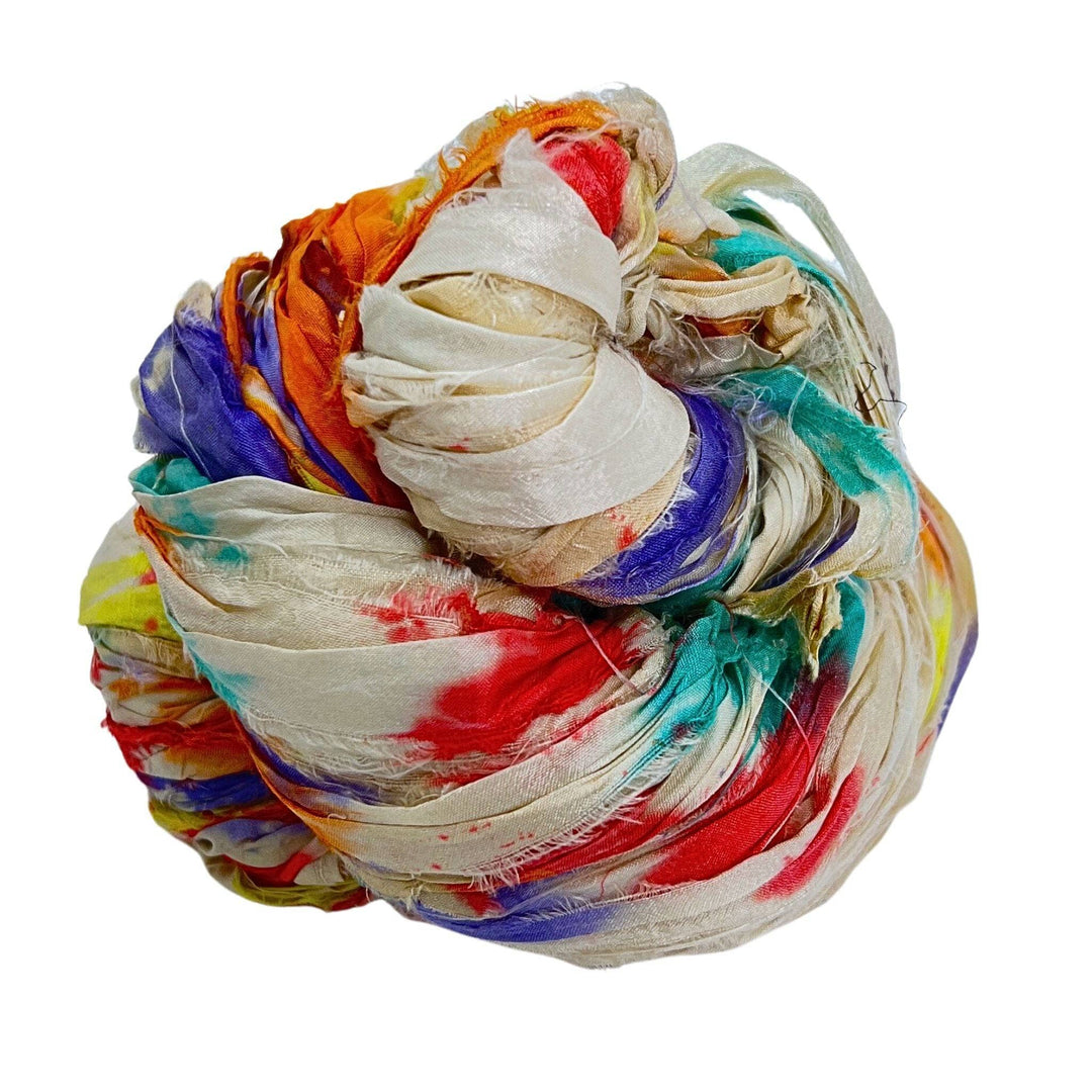 Tightly wrapped multi-colored silk fabric bundle with shades of red and blue.