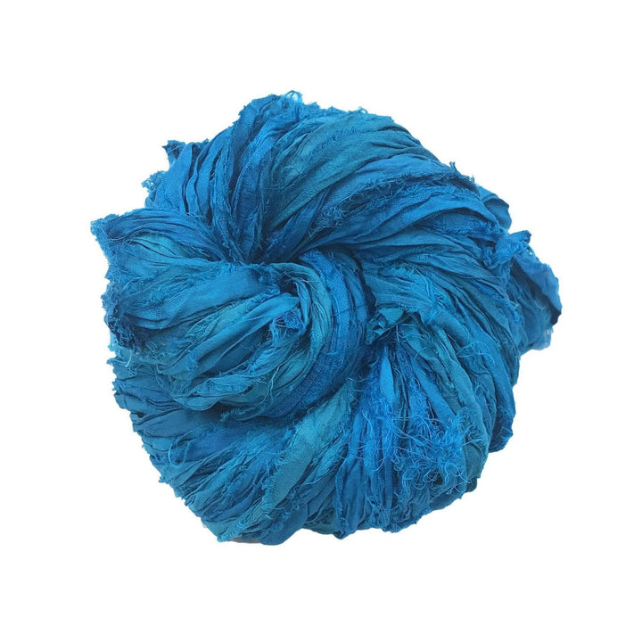 Ball of crumpled blue fabric tightly knotted for a textured look.