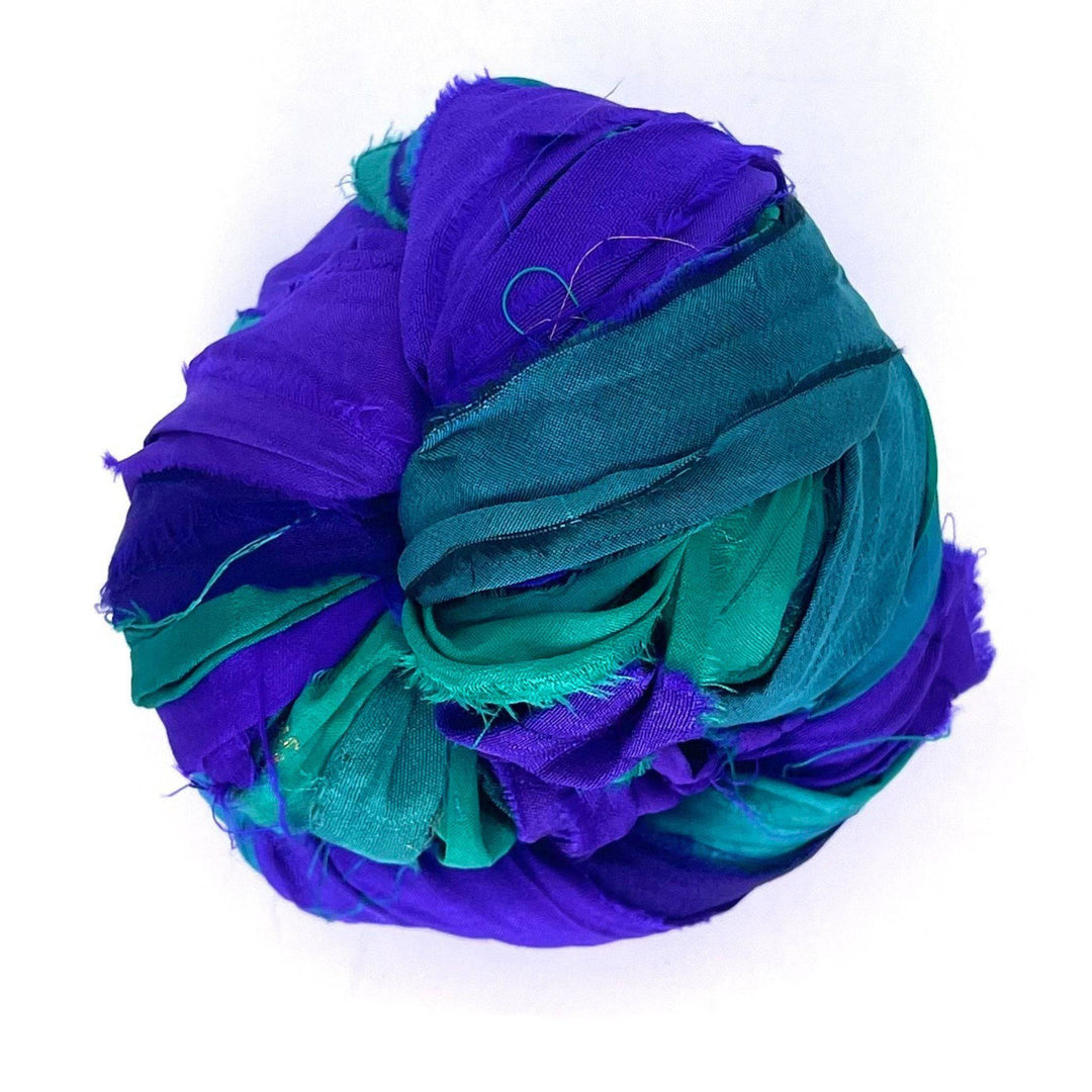 A used multi-color sari silk Yarn rolled.