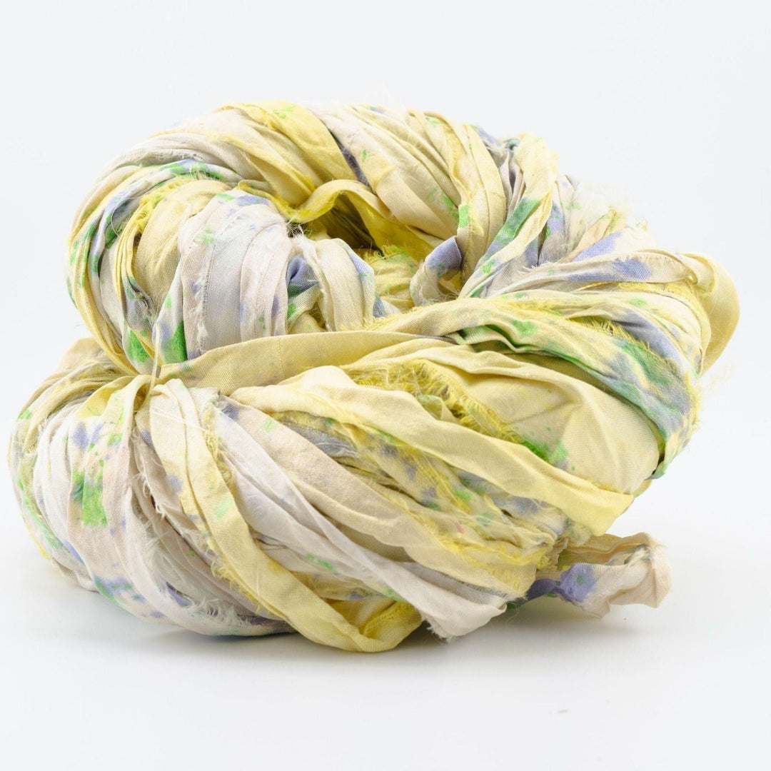 A used yellow sari silk Yarn rolled.