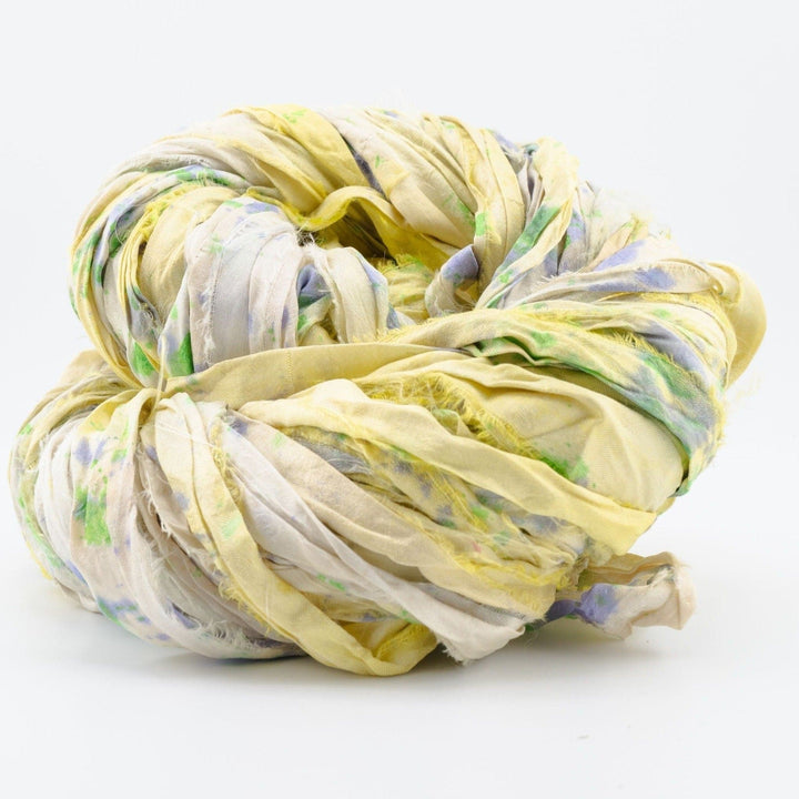 A used yellow sari silk Yarn rolled.